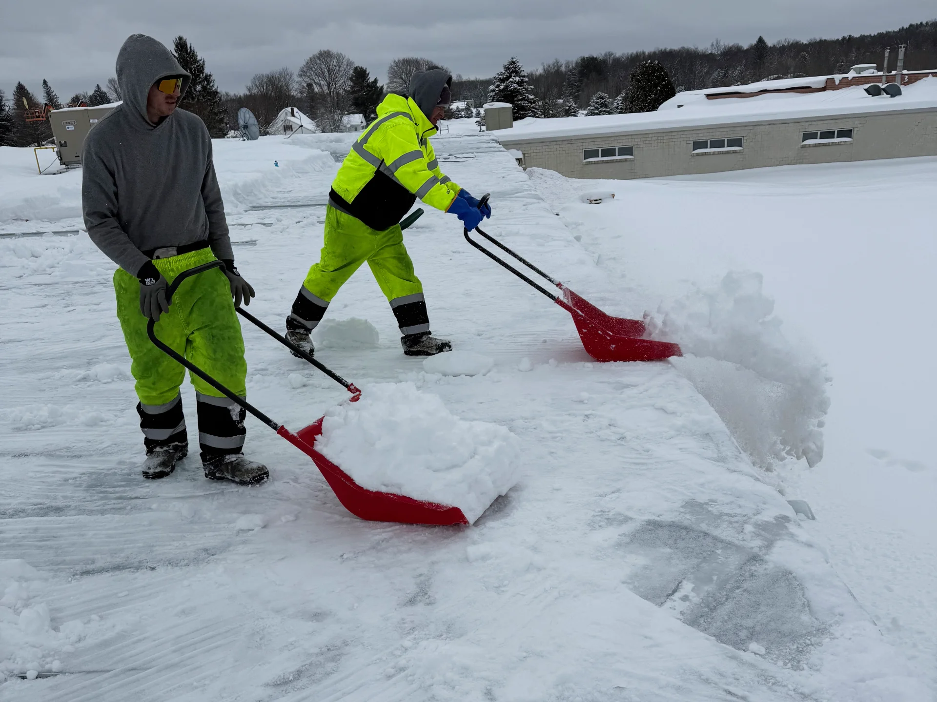 Commercial roof snow removal service